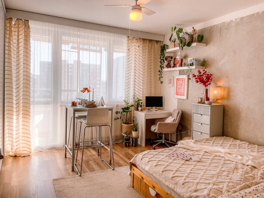 A bright and cozy Scandinavian-style bedroom with wooden floors, plants, and modern furnishings.